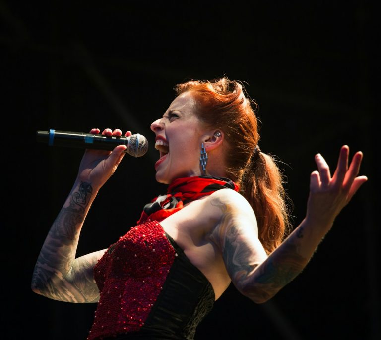 woman singing on wireless microphone